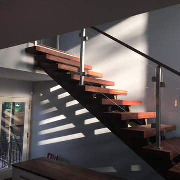 Walnut and glass railing floating staircase