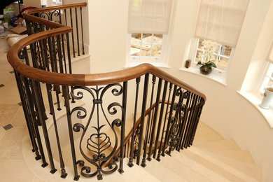 Photo of a medium sized classic curved staircase in London.