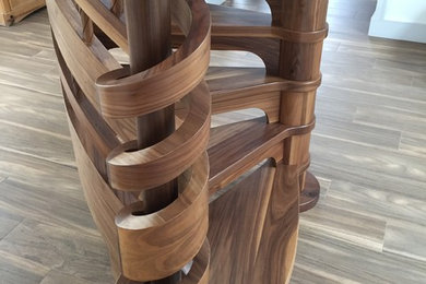 Photo of a medium sized contemporary wood spiral wood railing staircase in Other with wood risers.