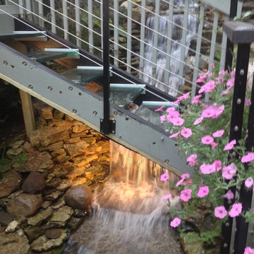 Waterfall in a landscape design with glass steps