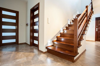 Mid-sized trendy wooden straight wood railing staircase photo in Miami with wooden risers
