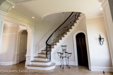 Inspiration for a large contemporary wooden curved staircase remodel in Boston with painted risers