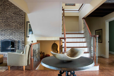 Inspiration for a mid-sized timeless wooden l-shaped metal railing staircase remodel in Chicago with painted risers
