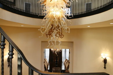 Inspiration for a large transitional wooden curved staircase remodel in Los Angeles with wooden risers
