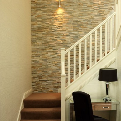 Transitional carpeted l-shaped staircase photo in Other with carpeted risers