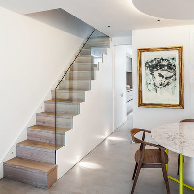 Example of a trendy wooden straight staircase design in London with wooden risers