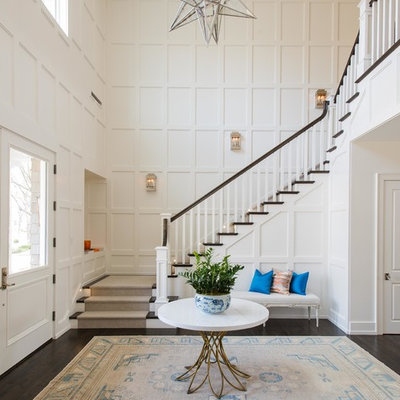 Large transitional wooden u-shaped wood railing staircase photo in Dallas with painted risers