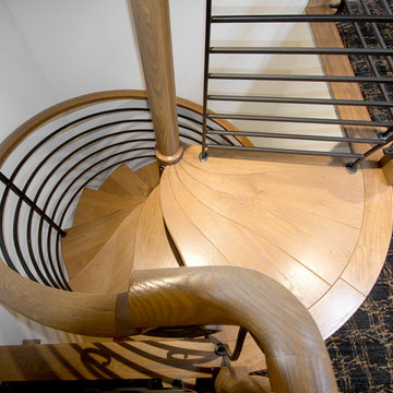 Whimsical White Oak Spiral Stair with Iron Balustrade