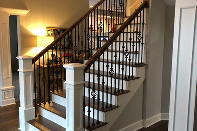 Example of a mid-sized trendy wooden l-shaped wood railing staircase design in Tampa with wooden risers