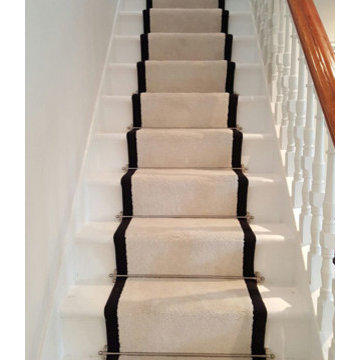 White Carpet With a Black Border to Stairs