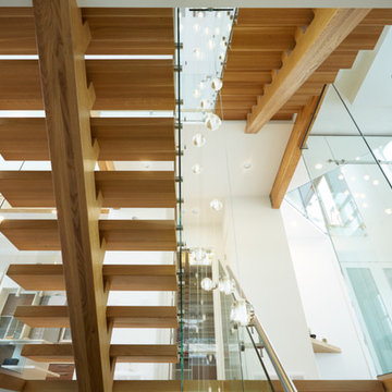 white oak mono stringer with stainless steel hand rail