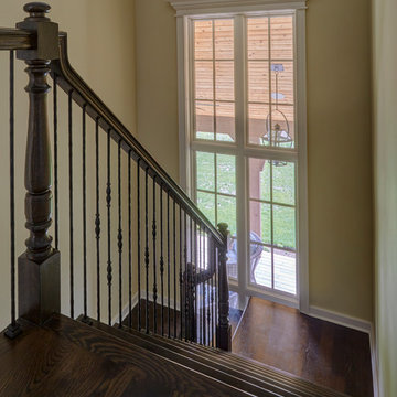 White Oak Staircase with 3-story Windows & Metal Balusters