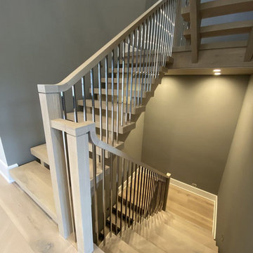 White Oak Stairs with Polished Stainless Steel Balusters