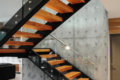 Staircase - large modern wooden floating staircase idea in Vancouver
