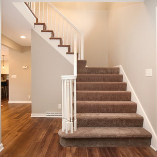 Elegant staircase photo in Grand Rapids