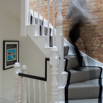 Wimbledon House - staircase with exposed bricks wall
