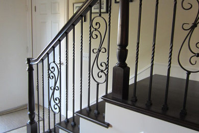 Example of a large classic wooden l-shaped staircase design in Orange County with wooden risers