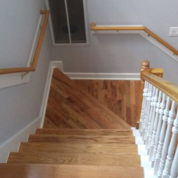 Wood stained stair and white trim.