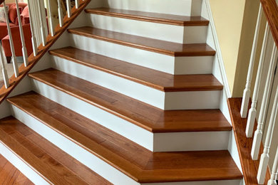 Inspiration for a mid-sized timeless wooden l-shaped wood railing staircase remodel in Baltimore with wooden risers