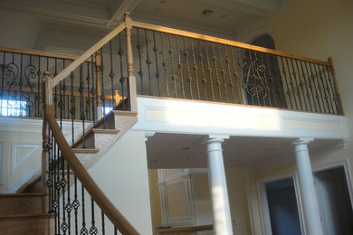 Example of a large classic wooden l-shaped staircase design in New York with wooden risers