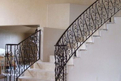 Example of a small danish tile curved staircase design in Denver with tile risers