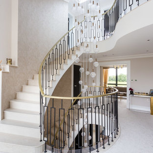 Inspiration for a medium sized classic curved metal railing staircase in Hertfordshire.