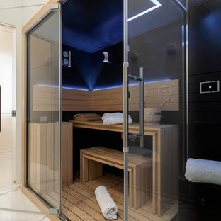 Foto di una sauna minimal con pareti nere e pavimento bianco