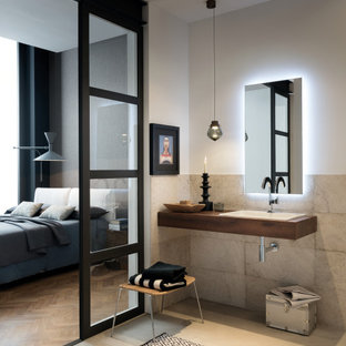 Ispirazione per una stanza da bagno con doccia design di medie dimensioni con piastrelle grigie, piastrelle in gres porcellanato, pareti bianche, pavimento in gres porcellanato, lavabo da incasso, pavimento grigio, top marrone e un lavabo