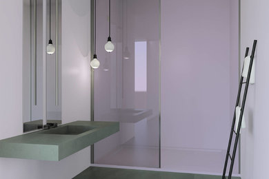 ボローニャにあるモダンスタイルのおしゃれなバスルーム (浴槽なし) (ピンクの壁、コンクリートの床、コンクリートの洗面台、グレーの床) の写真
