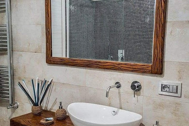 Foto di una stanza da bagno shabby-chic style con piastrelle beige, piastrelle in gres porcellanato e lavabo a bacinella