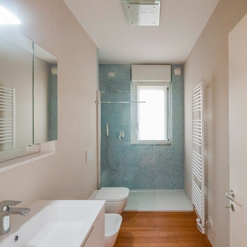 Light blue bathroom with bamboo flooring
