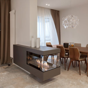 Exempel på ett mellanstort modernt kök med matplats, med beige väggar och en dubbelsidig öppen spis