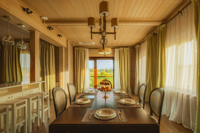 This is an example of a large scandi kitchen/dining room in Moscow with white walls, dark hardwood flooring and brown floors.