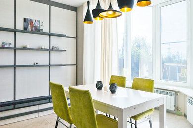 Inspiration pour une salle à manger ouverte sur le salon design avec un mur blanc.