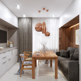 Diseño de comedor actual, pequeño, sin chimenea, con suelo de baldosas de porcelana y suelo blanco