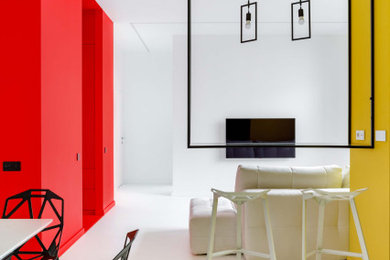 На фото: гостиная-столовая в современном стиле с белыми стенами и белым полом с