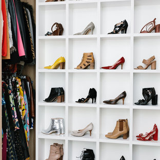 Photo of a mid-sized contemporary women's walk-in wardrobe in Melbourne with open cabinets, medium wood cabinets, carpet and grey floor.