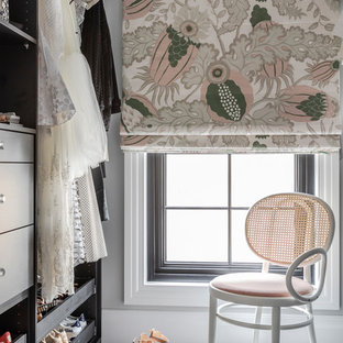 This is an example of a transitional walk-in wardrobe in Sydney with flat-panel cabinets, grey cabinets, carpet and white floor.