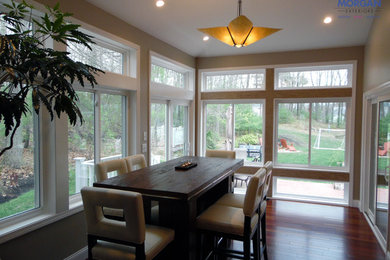 Inspiration for a mid-sized rustic dark wood floor sunroom remodel in Boston with no fireplace and a standard ceiling