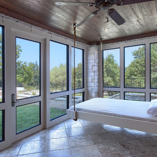 Photo of a mediterranean conservatory in Austin with a standard ceiling and beige floors.