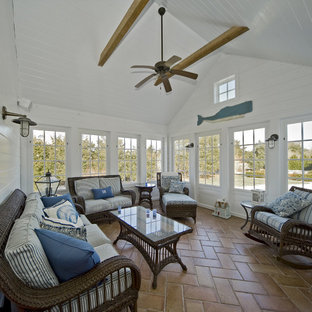 Sunroom - coastal terra-cotta tile and orange floor sunroom idea in Boston with a standard ceiling