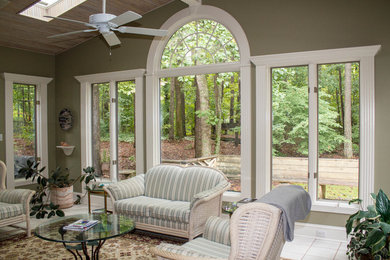 Inspiration for a small transitional ceramic tile and beige floor sunroom remodel in Atlanta with a skylight, a standard fireplace and a tile fireplace