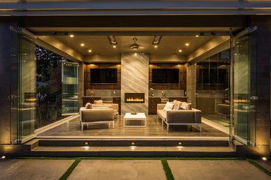 Example of a large transitional ceramic tile and gray floor sunroom design in San Francisco with a ribbon fireplace, a standard ceiling and a stone fireplace