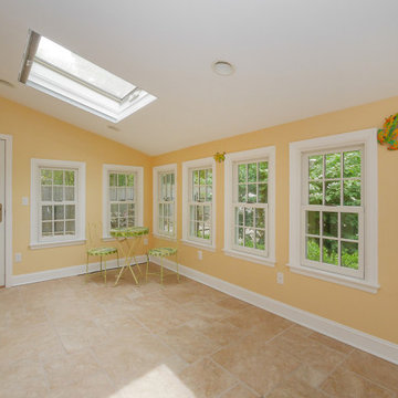 Bright and Cheery Sun Room with All New Windows