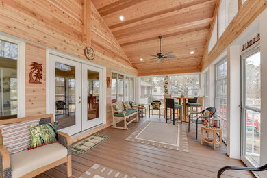 Inspiration for a mid-sized craftsman dark wood floor and brown floor sunroom remodel in Other with no fireplace and a standard ceiling