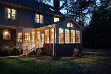 Inspiration for a mid-sized timeless light wood floor sunroom remodel in Raleigh with a standard ceiling