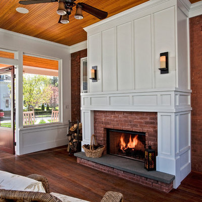 Mid-sized elegant dark wood floor sunroom photo in Boston with a standard ceiling, a brick fireplace and a standard fireplace