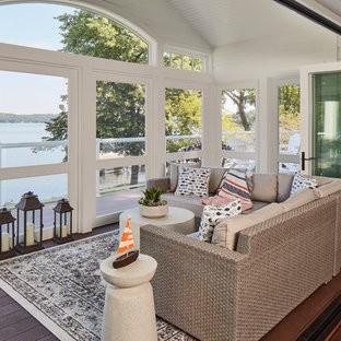 Inspiration for a coastal dark wood floor and brown floor sunroom remodel in Milwaukee with no fireplace and a standard ceiling