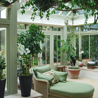 This is an example of a medium sized mediterranean conservatory in Chicago with a glass ceiling.