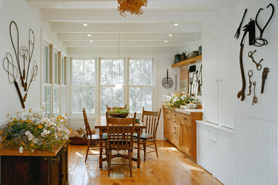 Mid-sized farmhouse light wood floor and brown floor sunroom photo in New York with no fireplace and a standard ceiling